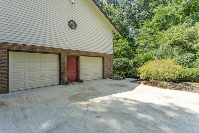 garage featuring driveway