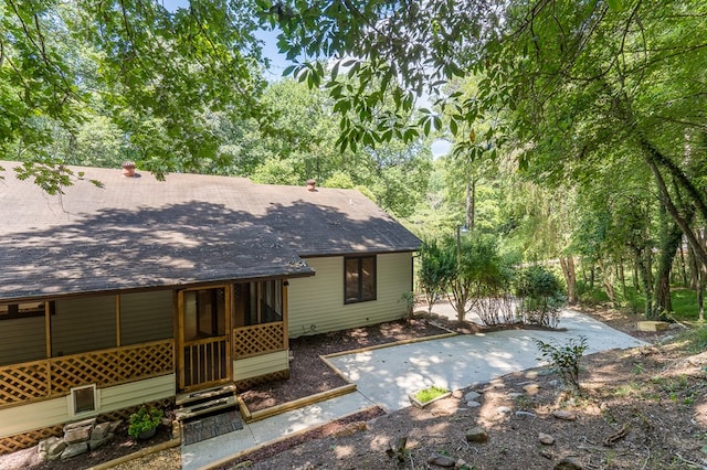 rear view of property with entry steps