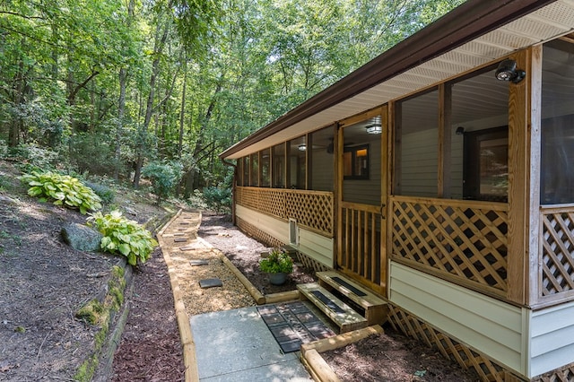 view of side of property with a sunroom