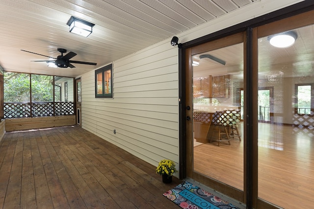 deck with covered porch and ceiling fan