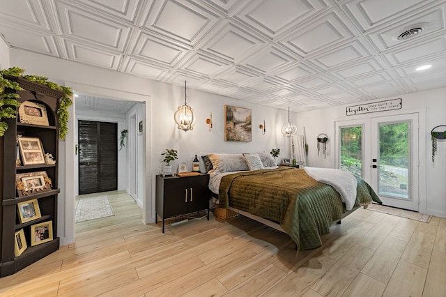 400 Creekside Dr, Mccaysville, GA 30555 - bedroom featuring access to exterior, an ornate ceiling, french doors, and light wood-style flooring
