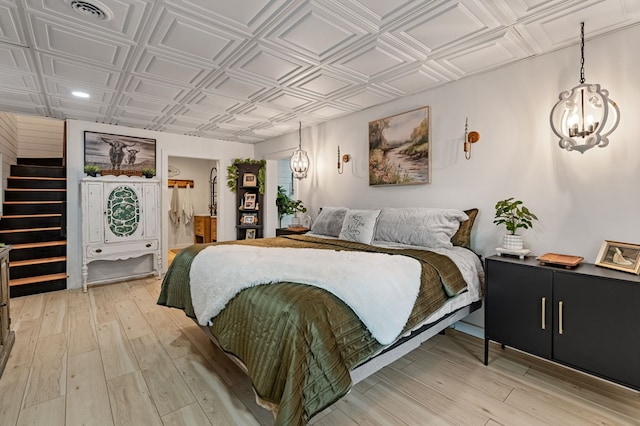 400 Creekside Dr, Mccaysville, GA 30555 - bedroom featuring an ornate ceiling, light wood-type flooring, a chandelier, recessed lighting, and ensuite bathroom
