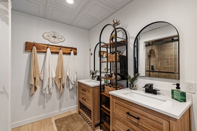 400 Creekside Dr, Mccaysville, GA 30555 - bathroom featuring two vanities, wood finished floors, baseboards, tiled shower, and recessed lighting