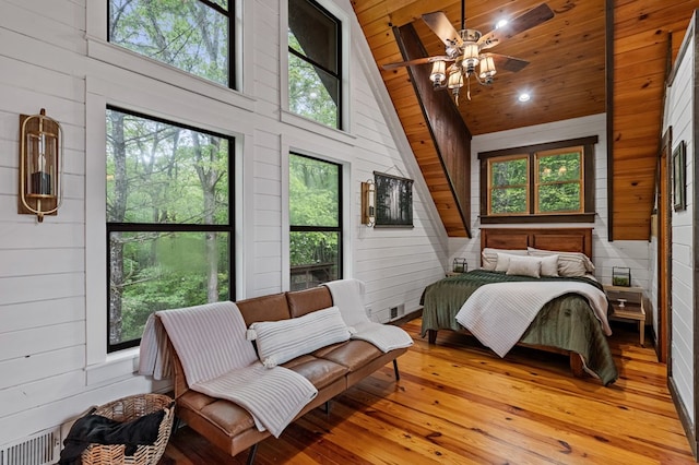 400 Creekside Dr, Mccaysville, GA 30555 - bedroom with wooden walls, light wood-style floors, high vaulted ceiling, and wood ceiling
