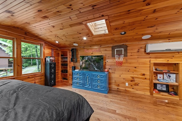 400 Creekside Dr, Mccaysville, GA 30555 - bedroom featuring a wall mounted AC, a skylight, lofted ceiling, wood finished floors, and wooden walls