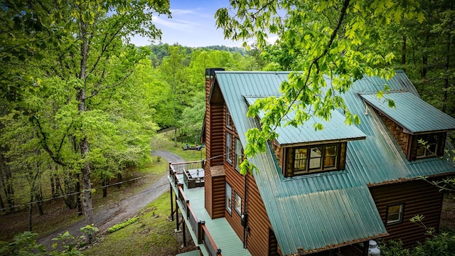 400 Creekside Dr, Mccaysville, GA 30555 - view of side of home with metal roof, a chimney, a view of trees, and stairway