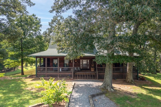 view of front of house with a front yard and french doors