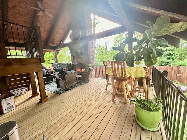 wooden terrace featuring outdoor lounge area