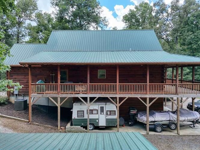 1394 Camp Creek Rd, Murphy, NC 28906 - rear view of house with a wooden deck, log siding, metal roof, and a carport