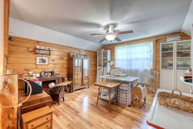 1394 Camp Creek Rd, Murphy, NC 28906 - home office featuring lofted ceiling, wood walls, a ceiling fan, and light wood finished floors