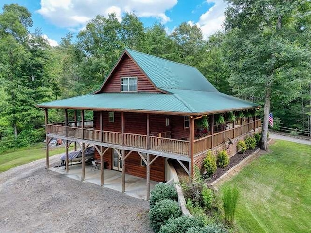 1394 Camp Creek Rd, Murphy, NC 28906 - view of front of house featuring metal roof, a front lawn, and a wooden deck