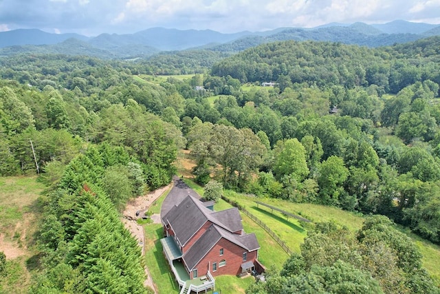 aerial view featuring a mountain view and a wooded view