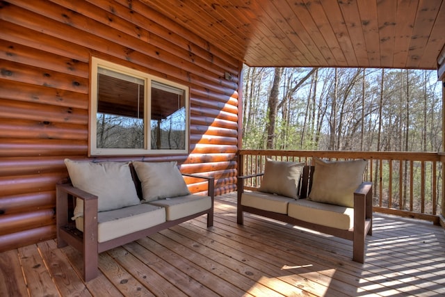 wooden terrace with outdoor lounge area