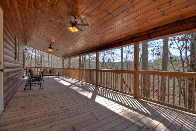 wooden deck featuring ceiling fan