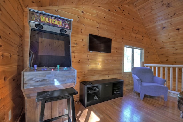 living room featuring wooden walls, wooden ceiling, lofted ceiling, and wood finished floors