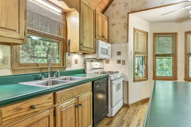 kitchen with white appliances, ceiling fan, light hardwood / wood-style floors, decorative backsplash, and sink