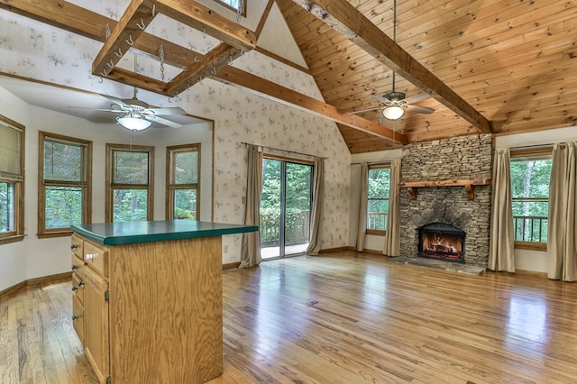 kitchen featuring plenty of natural light, a kitchen island, and light wood-type flooring