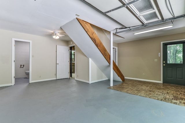 interior space featuring concrete floors and ceiling fan