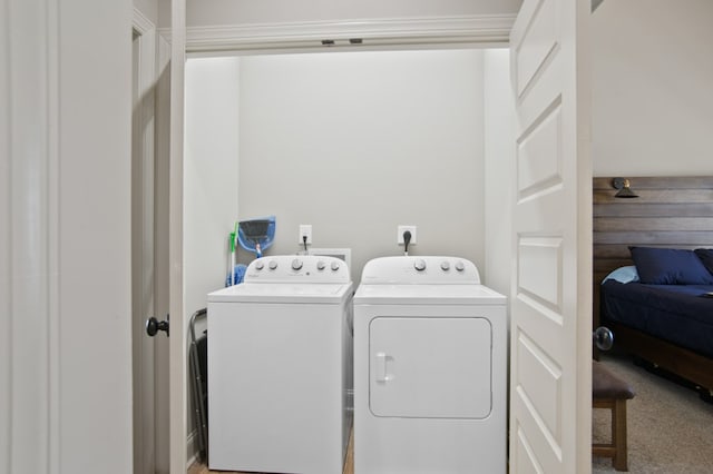 laundry room featuring laundry area, carpet flooring, and independent washer and dryer