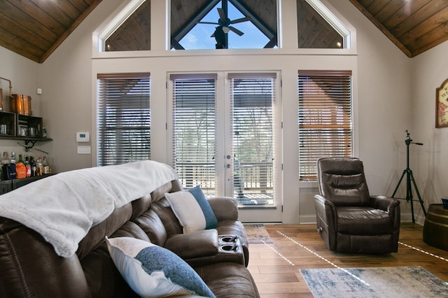 bedroom with access to outside, wood ceiling, french doors, and wood finished floors