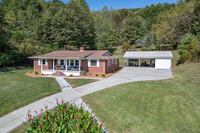 ranch-style house featuring a garage, a front lawn, and covered porch