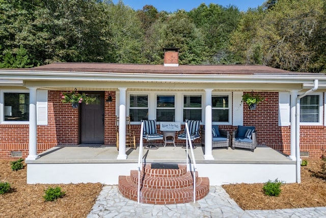 doorway to property featuring a porch