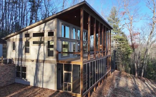 view of home's exterior featuring a sunroom