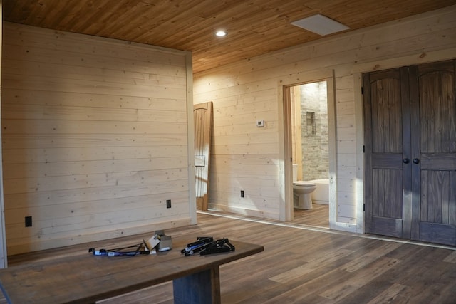 interior space with hardwood / wood-style flooring, wooden walls, and wooden ceiling