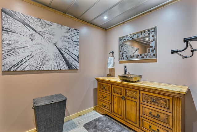 bathroom featuring vanity and wood-type flooring