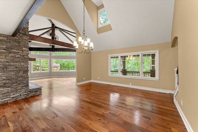 802 Old Mill Trl, Ball Ground, GA 30107 - unfurnished living room with high vaulted ceiling, a chandelier, wood-type flooring, baseboards, and beam ceiling