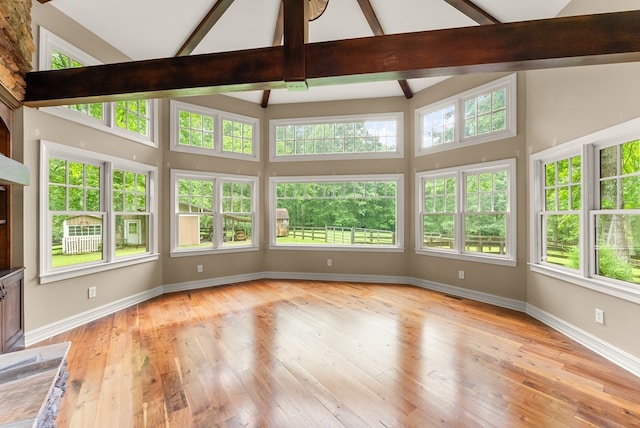 802 Old Mill Trl, Ball Ground, GA 30107 - unfurnished sunroom with plenty of natural light, high vaulted ceiling, beamed ceiling, wood-type flooring, and baseboards