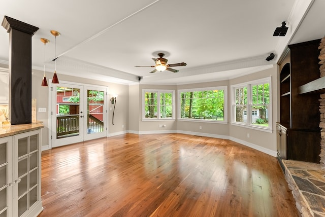 802 Old Mill Trl, Ball Ground, GA 30107 - unfurnished living room with a ceiling fan, ornamental molding, light wood-style floors, and baseboards