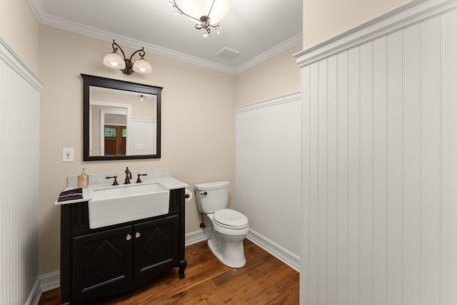 802 Old Mill Trl, Ball Ground, GA 30107 - bathroom with wood finished floors, toilet, vanity, crown molding, and baseboards