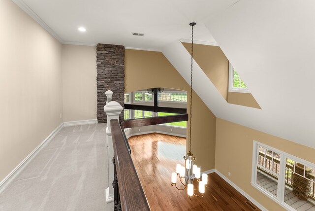 802 Old Mill Trl, Ball Ground, GA 30107 - stairway featuring plenty of natural light, baseboards, lofted ceiling, a chandelier, and ornamental molding