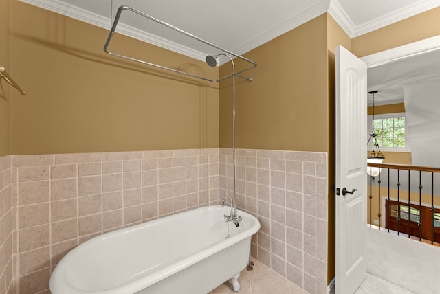 802 Old Mill Trl, Ball Ground, GA 30107 - bathroom with tile walls, a soaking tub, ornamental molding, tile patterned flooring, and a wainscoted wall