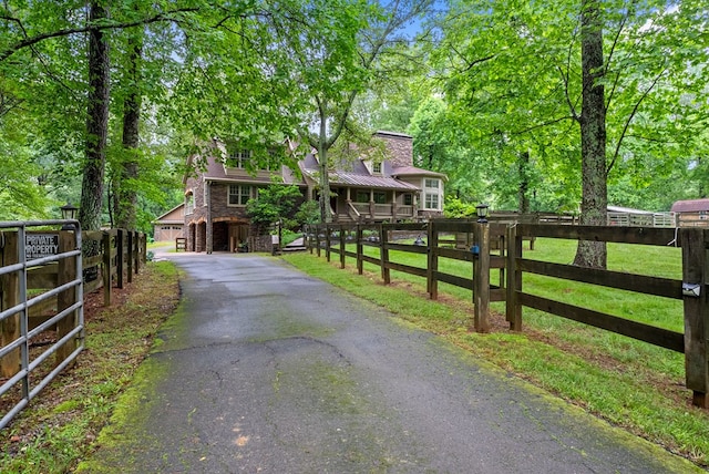 802 Old Mill Trl, Ball Ground, GA 30107 - view of front of property with asphalt driveway, stone siding, and metal roof