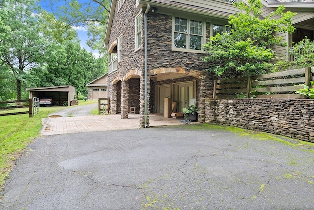 802 Old Mill Trl, Ball Ground, GA 30107 - view of front of property with stone siding and driveway