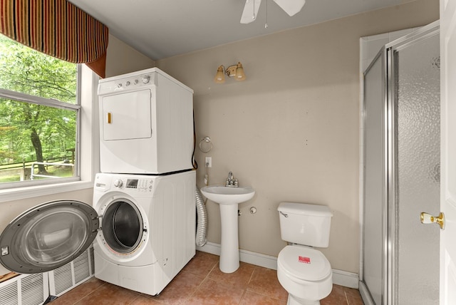 802 Old Mill Trl, Ball Ground, GA 30107 - laundry room featuring estacked washer and dryer, tile patterned flooring, plenty of natural light, and a ceiling fan
