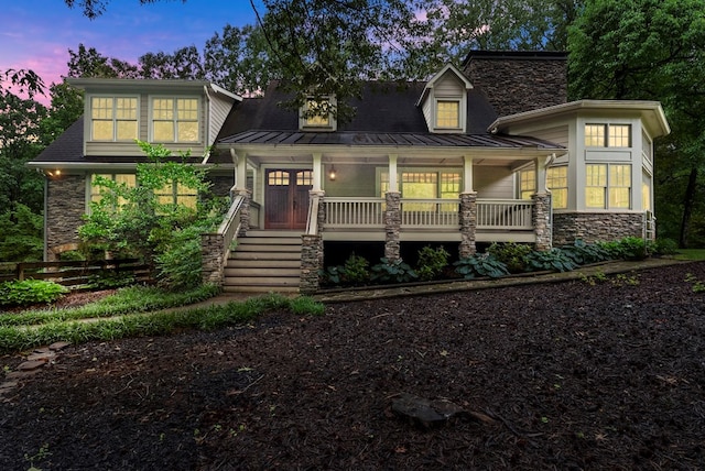 802 Old Mill Trl, Ball Ground, GA 30107 - view of front of house with stone siding, a standing seam roof, covered porch, and metal roof