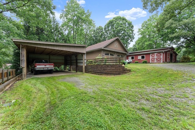 802 Old Mill Trl, Ball Ground, GA 30107 - view of front facade with driveway, an outbuilding, and a carport