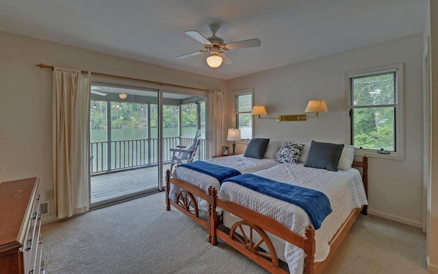 carpeted bedroom with ceiling fan and access to outside