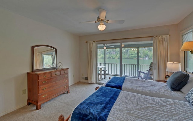 carpeted bedroom with ceiling fan and access to exterior