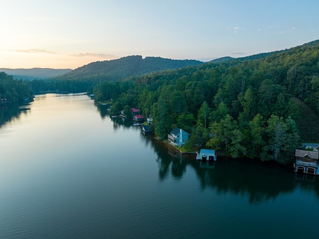 aerial view at dusk with a water view