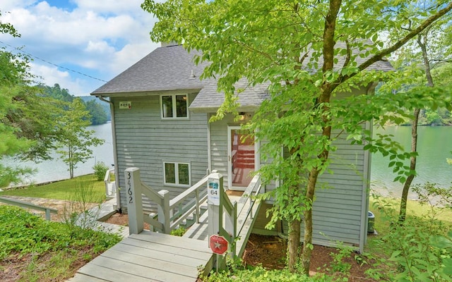 rear view of house with a water view