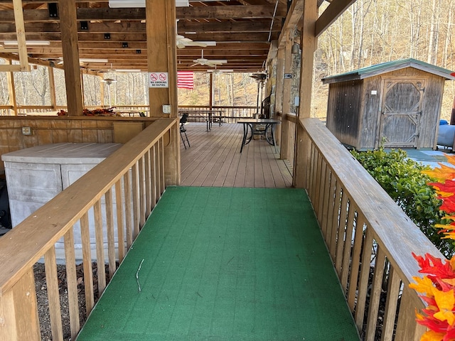 wooden deck featuring ceiling fan