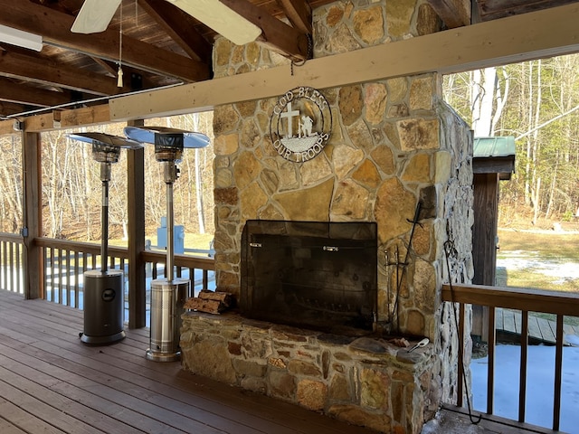 wooden deck with a fireplace