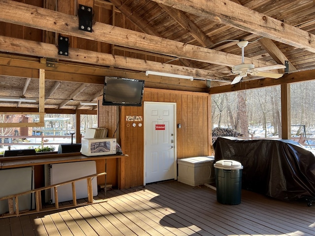 wooden deck featuring ceiling fan