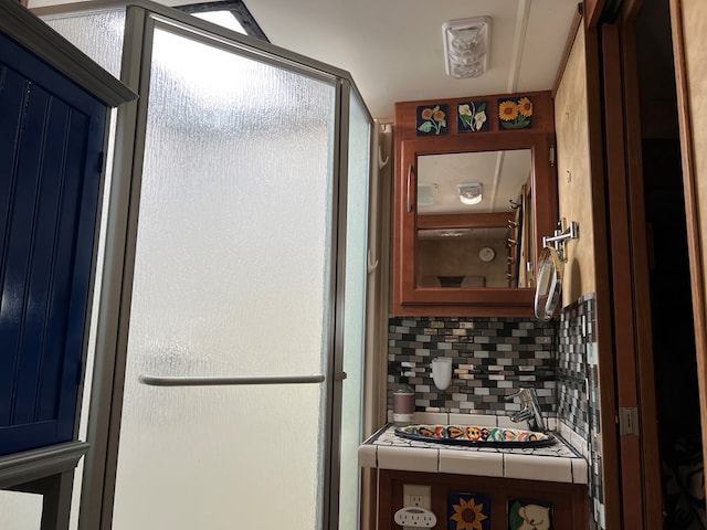 kitchen with decorative backsplash and tile countertops