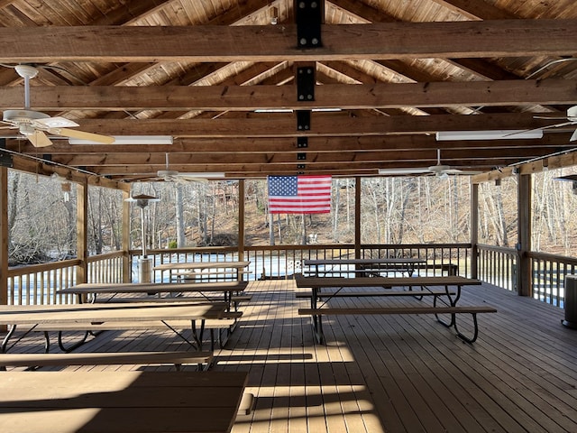 wooden deck featuring ceiling fan