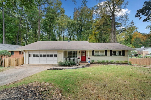 ranch-style home with a front lawn and a garage